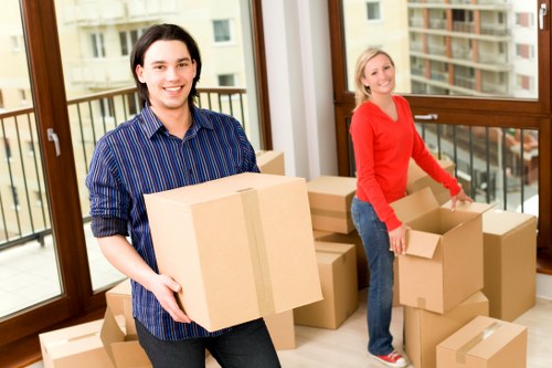 Packing boxes and wrapping fragile items for a Tolworth move